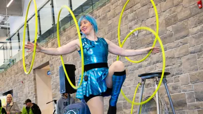 Gymnast performing on stage.