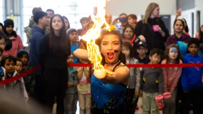 Fire busker in front of a crowd.