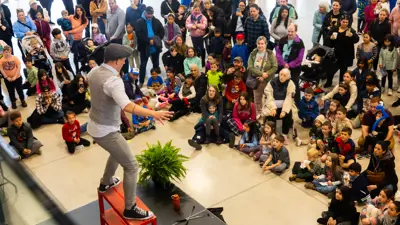 Performer on stage in front of a crowd at LaSalle Spring Fling 2024.