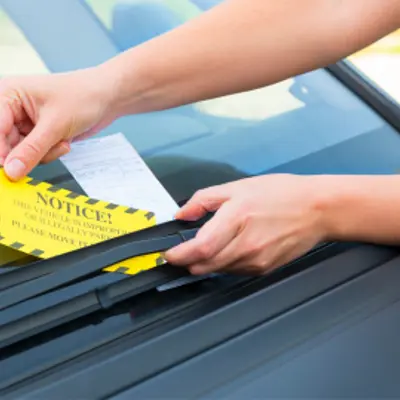 Photo of parking ticket on dashboard